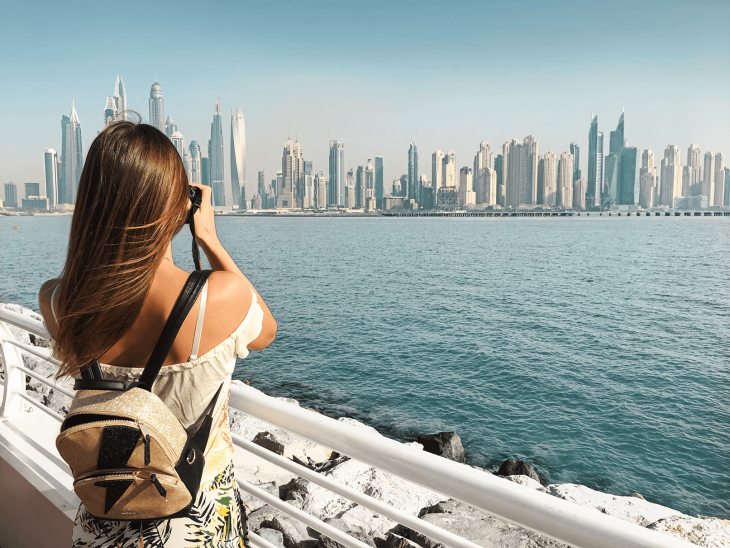 Photo of girl in dubai - how to travel the world and make money