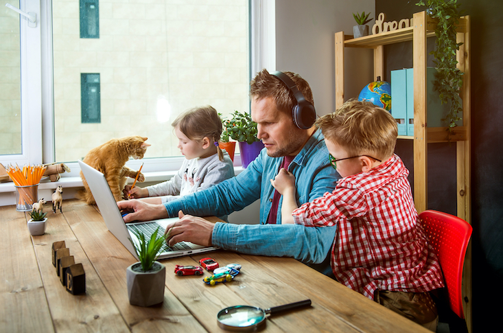 Parent working from home with kids.